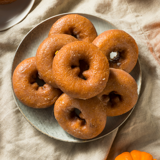 A plate full of Cinnamon Sugar Protein Pumpkin Donuts