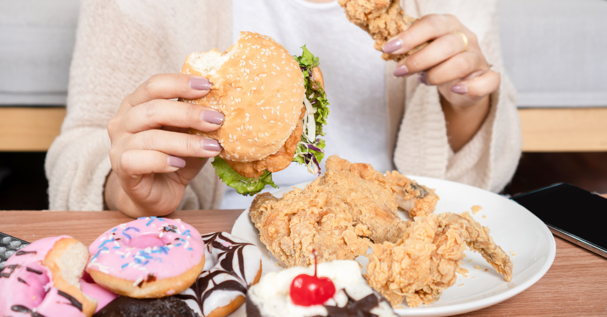 Woman eating unhealthy food