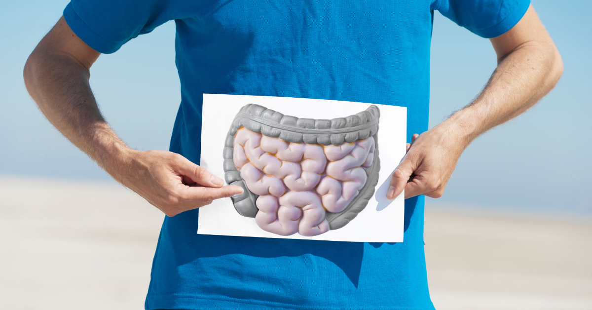 A man displays a photo of his intestines in pursuit of Digestive health and gut health. 