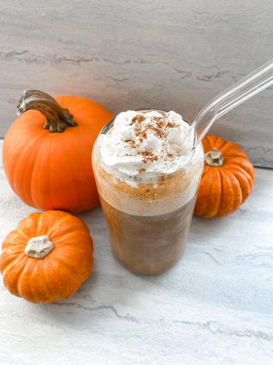Pumpkin Spice Protein Coffee with a spoon and minipumpkins