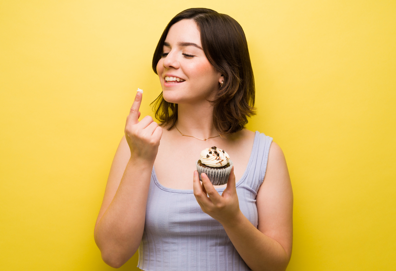 Beautiful young Woman struggles with her food cravings.