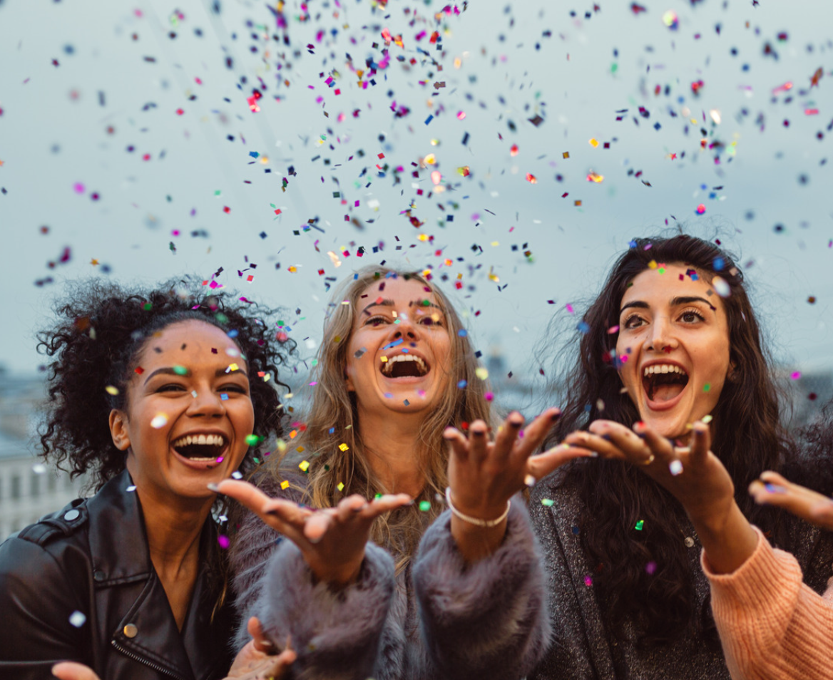 Three young women celebrate the holiday season with a Social gathering